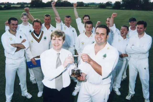 Andy Plaice presents the Frank Woodhead Cup to Jonathan Perkins, captain of winners Old Dalby Cricket Club, during his tenure as Melton Times editor EMN-200221-132839001