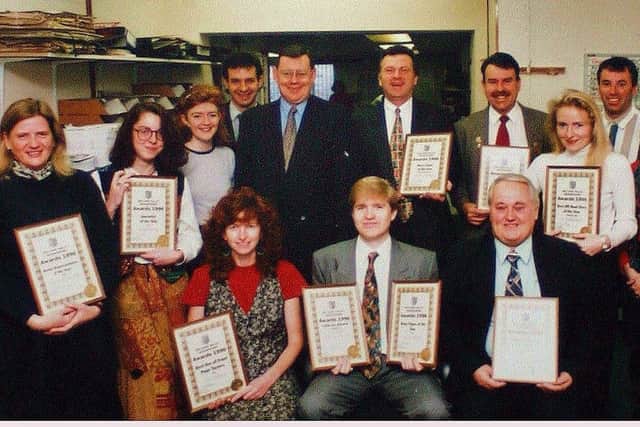 Andy Plaice (front row, centre) pictured with fellow Melton Times staff after a successful newspaper awards presentation night in the mid-1990s EMN-200221-133826001