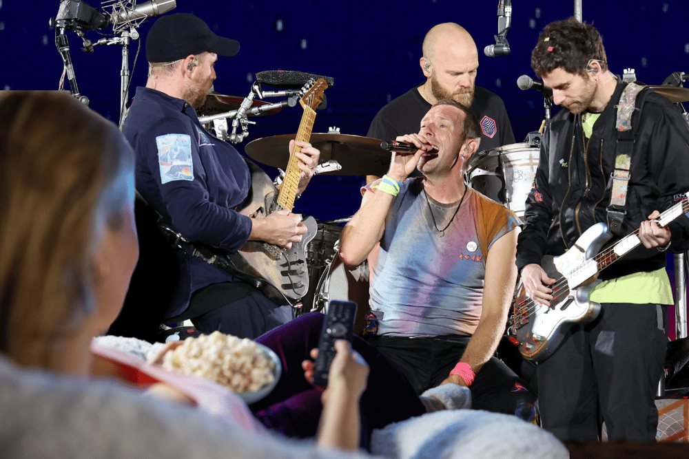No need to shove, unless there's no room on the couch; for those who aren't heading to Glastonbury this week, there are plenty of other ways to follow the festival comprehensively without ruining your favourite pair of Hunters (Credit: Getty/Canva)
