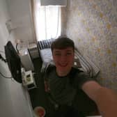 George Redfern, 21, stayed in the cheapest hotel in the UK for £16 a night. Pictured at the Coco Beach Hotel, in Blackpool.