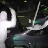 Nathan Smith, 33, has been jailed for 5 years. Here he is smashing the windscreen of a vehicle, while wearing a balaclava, gloves and brandishing a machete.