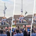 This is the heart-stopping moment an Indian fan plunged 30ft after trying to tie a flag around a pole during wild T20 World Cup celebrations. 