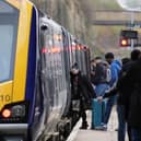 Passengers board train.