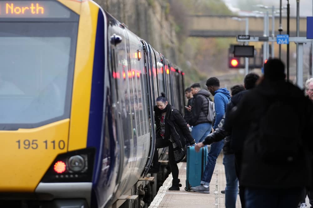 Passengers board train.