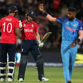 Alex Hales of England congratulates  Jos Buttler of England on his 50th run during the ICC Men's T20 World Cup Semi Final match between India and England at Adelaide Oval on November 10