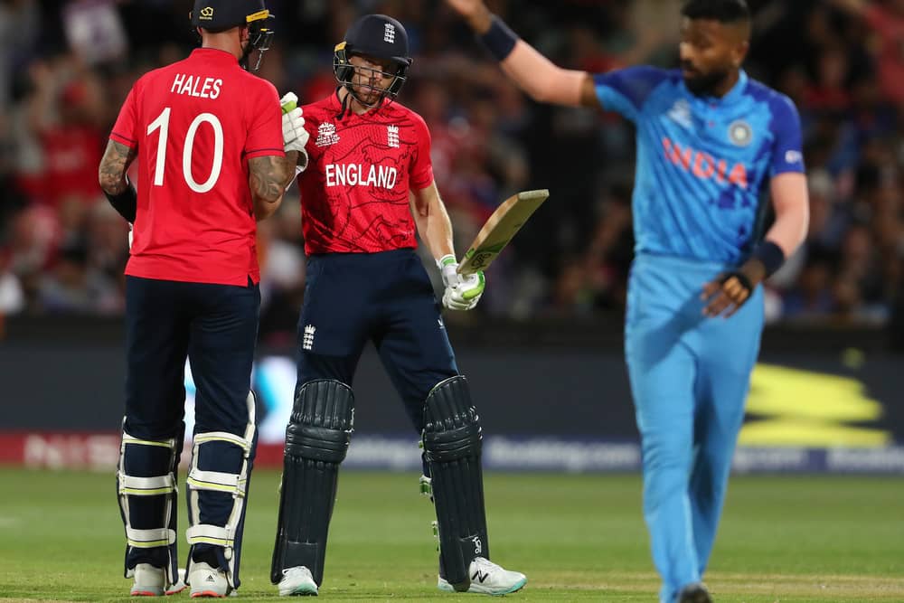 Alex Hales of England congratulates  Jos Buttler of England on his 50th run during the ICC Men's T20 World Cup Semi Final match between India and England at Adelaide Oval on November 10