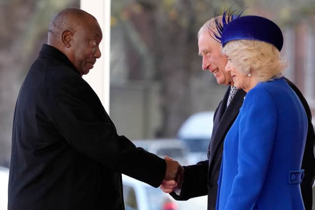 South Africa's President Cyril Ramaphosa is greeted by Britain's King Charles III and Britain's Camilla, Queen Consort