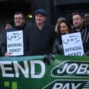 RMT general secretary Mick Lynch (centre) on an RMT picket line during January’s strike (Photo by DANIEL LEAL/AFP via Getty Images)