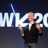 Josh D’Amaro, Disney’s parks and experiences chairman, with a ‘real’ Star Wars lightsaber