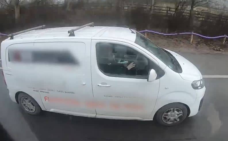 Motorists caught on camera watching a film while driving
