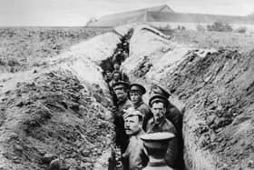 28th October 1914:  British soldiers lined up in a narrow trench during World War I.  (Photo by Hulton Archive/Getty Images)