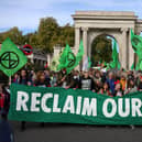 Protesters march into central London at a demonstration by the climate change protest group Extinction Rebellion, on October 16, 2022. Credit: Isabel Infantes/AFP.