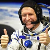 Britain's astronaut Tim Peake gestures as his space suit is tested at the Russian-leased Baikonur cosmodrome (photo: Getty Images)