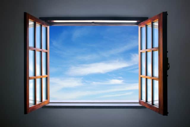 Open a window to let in fresh air rather than using air freshners in the home (photo: adobe)