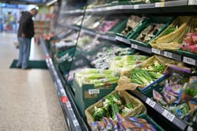 A shopper browses for fruit and vegetables in a Tesco supermarket in London on December 14, 2020 (Getty Images)