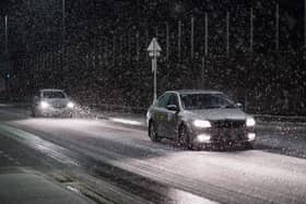 Motorists drive through a heavy snow shower as it passes over Saltburn By The Sea as Storm Arwen sweeps across parts of the country on November 26, 2021 (Photo: Getty)