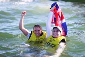 Hannah Mills (L) and Eilidh McIntyre of Team Great Britain celebrate following the Women's 470 class medal race on day twelve of the Tokyo 2020 Olympic Games (Photo by Clive Mason/Getty Images)