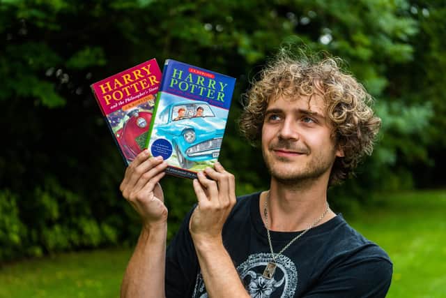Max Roe with first edition copies of Harry Potter books his mum got him when he was young - one signed by JK Rowling could be worth £10,000.
