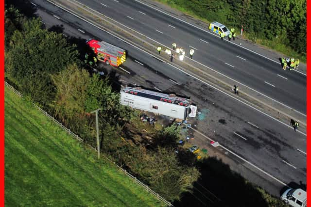 Emergency services at the scene of a coach crash on the M53 motorway, between junction 5 at Ellesmere Port and junction 4 at Bebbington. 