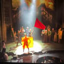 Just Stop Oil protesters rushed the stage of the Sondheim Theatre in London while a performance of Les Miserable was ongoing. (Credit: Just Stop Oil/PA Wire)