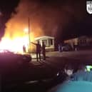 Bodycam footage shows heroic police response to a large caravan fire in Cranbourne.