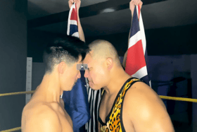 Star actor Derek Siow wrestling with professional wrestler Rishi Ghosh in rehearsal performance