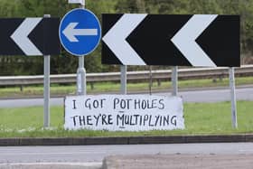 Protest sign at a roundabout on Eastern Way in Daventry - A series of protest signs highlighting the Daventry pothole problem by the mystery campaigner.  