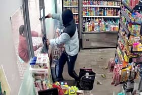 CCTV of an armed robbery where the burglars yielded a machete. 