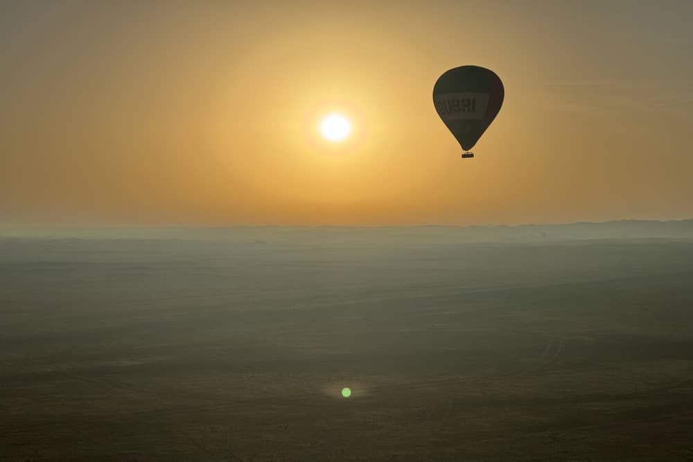 Journalist Nicola Adam journeys across the Dubai desert at dawn by hot air balloon

