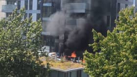 Fire rages at 22-storey tower block.