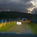 Passenger hurls freezer from van door during police chase in South Wales.