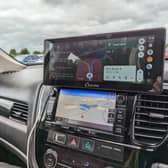 The Carpuride W103 sits on top of your dashboard, or on the windscreen, and gives you full access to Android Auto or Apple CarPlay
