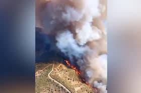 Fire rages between two popular tourist destinations
