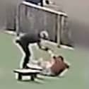 Still from footage of William Kevin Clifford subjecting 11-year-old Tobie Orlowski to a sustained attack in which he pushed the schoolboy to the ground multiple times in the grounds of Tettenhall Wood School in Wolverhampton. 