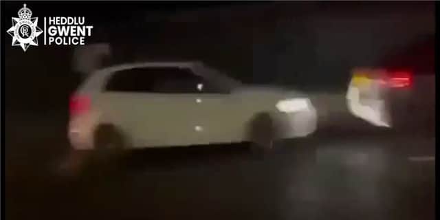 Two men smash into back of taxi driver during high-speed race.
