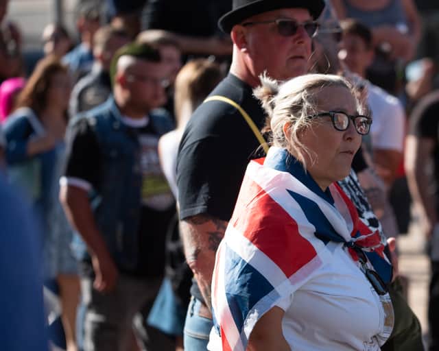 Protestor at a 'Pro-Britain' rally wears a Union Jack flag.