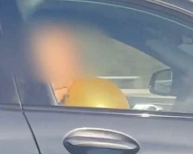 BMW driver filmed inhaling from what appeared to be a 'hippy crack balloon' on the M6.