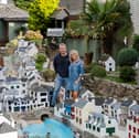Lee and Julie Gregory with the model of Polperro in Cornwall which is now up for sale.