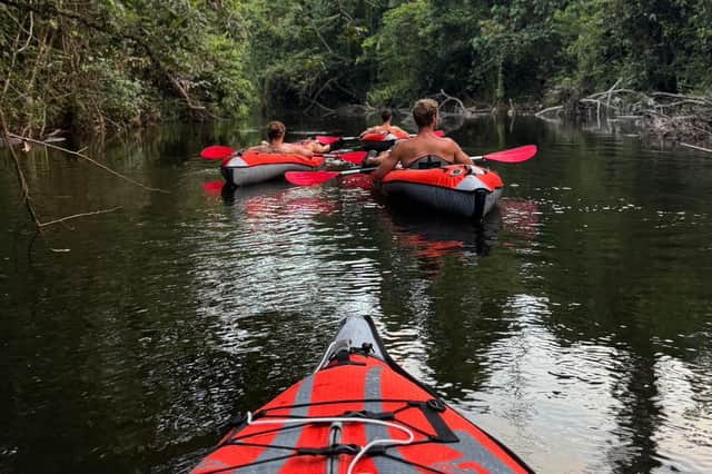 Ash Dykes and his team mates aboard their kayaks.