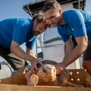 Todd German from SeaLife Scarborough and Scott Blacker from SeaLife Blackpool releasing Nazare a loggerhead sea turtle into the sea off the coast of Horta in the Azores