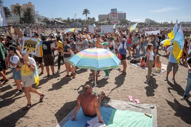 Over-tourism protesters march on a Playa de las Américas beach on October 20 2024.