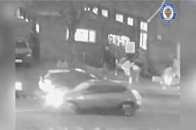 CCTV captures the moment three mourners are shot in a drive-by shooting at a funeral.