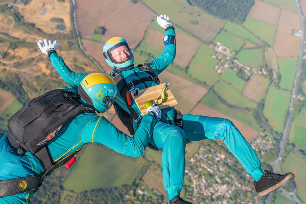 Parachuters performed mid-air manoeuvres which saw the bright turquoise liquid shaken and stirred from heights up to 10,000ft