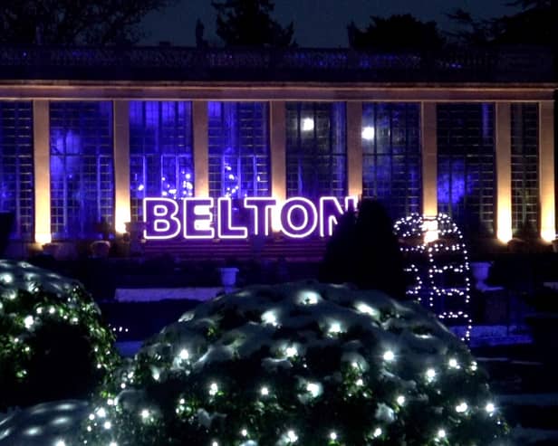 A huge lit Belton sign outside The Orangery welcomes visitors to Christmas At Belton 2024