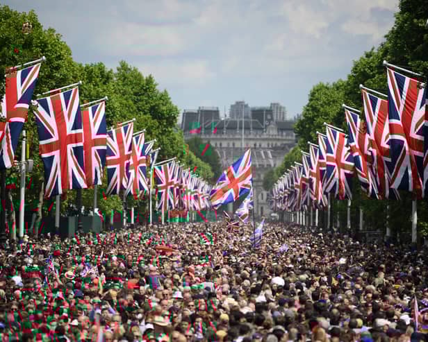 Members of the public fill The Mall before a flypast during the Queen's Birthday Parade, the Trooping the Colour, as part of Queen Elizabeth II's Platinum Jubilee celebrations in London in June 2022 (Photo: DANIEL LEAL/POOL/AFP/AFP via Getty Images)