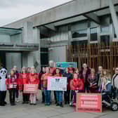 ME Action UK campaigners gather in Parliament Square to demand the £100s millions missing from ME research.