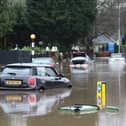 Cars stranded in deep water due to flooding in Stockport.