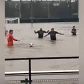 Lydney Town AFC players swim in flooded pitch