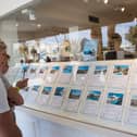 Tourists look at apartments in the window shop of a real estate on the island of Ibiza (Photo: JAIME REINA/AFP via Getty Images)