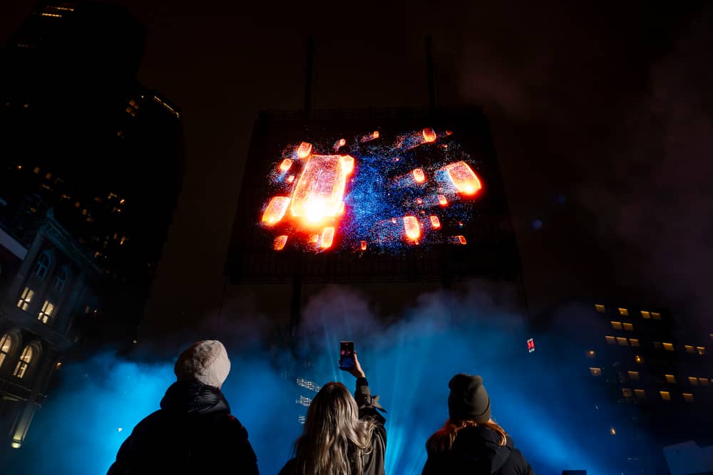 Visuals of a blue whale, northern lights, and football tricks are displayed in a hologram show over London